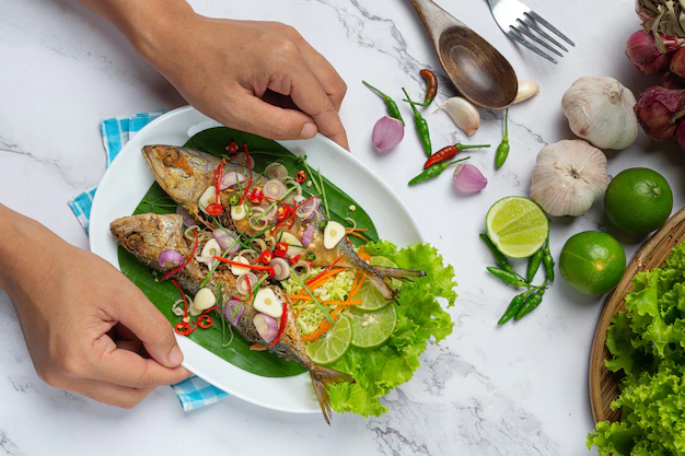hot spicy mackerel decorated with thai food ingredients 1150 25372