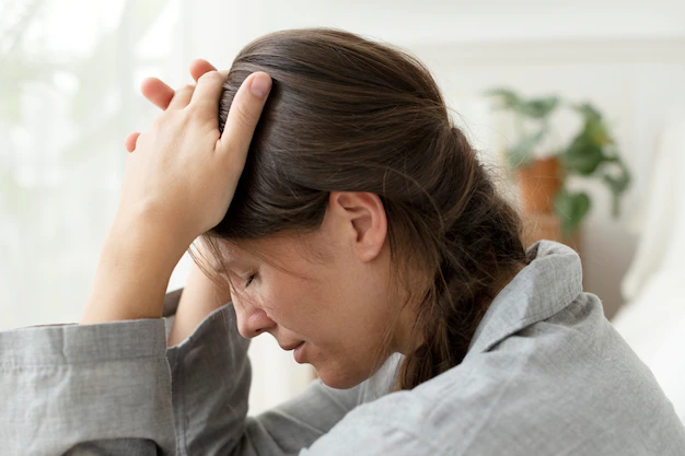 woman suffering from migraine headache 53876 125366