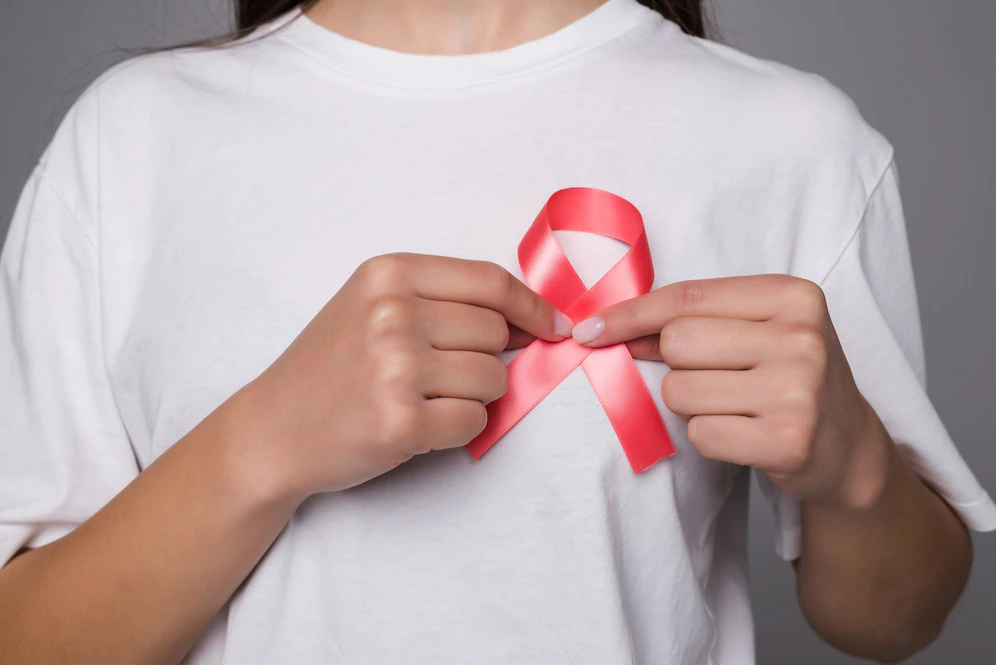 world breast cancer day concept health care woman wore white t shirt with pink ribbon awareness symbolic bow color raising people living with women s breast tumor illness 231208 11865